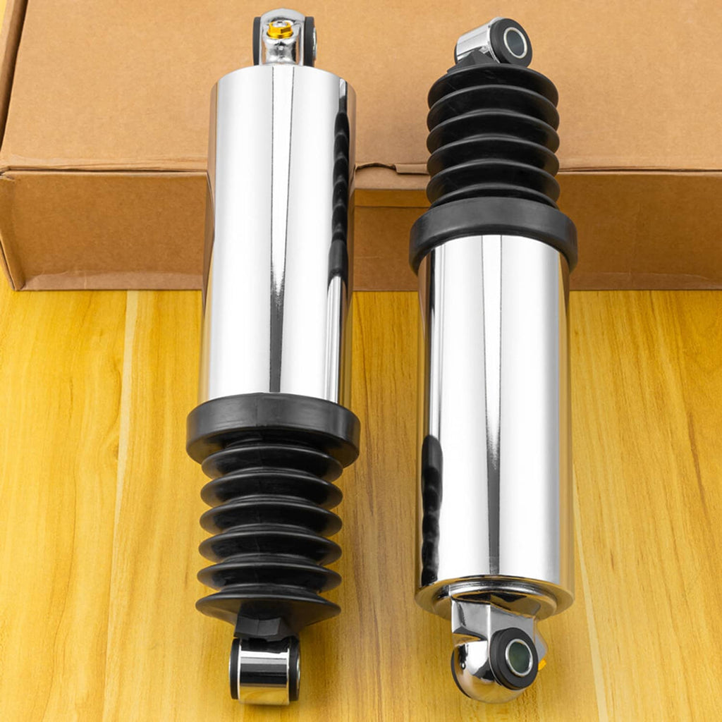 Two chrome rear air suspension shocks with black dust boots and gold-topped fittings