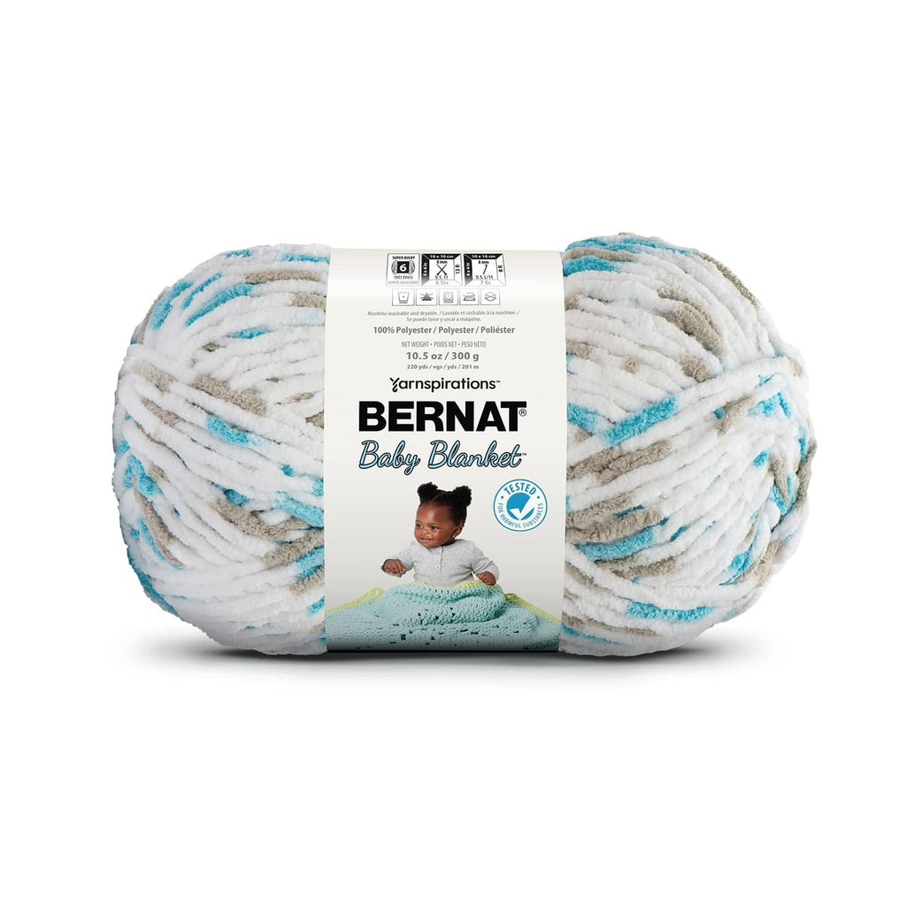 Bernat Baby Blanket yarn skein in white with light teal speckles and band label