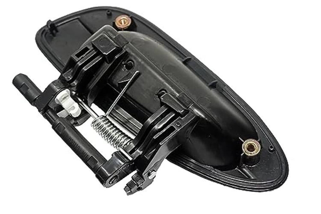 Exterior door handle internal mechanism in black housing with gold-toned pin.