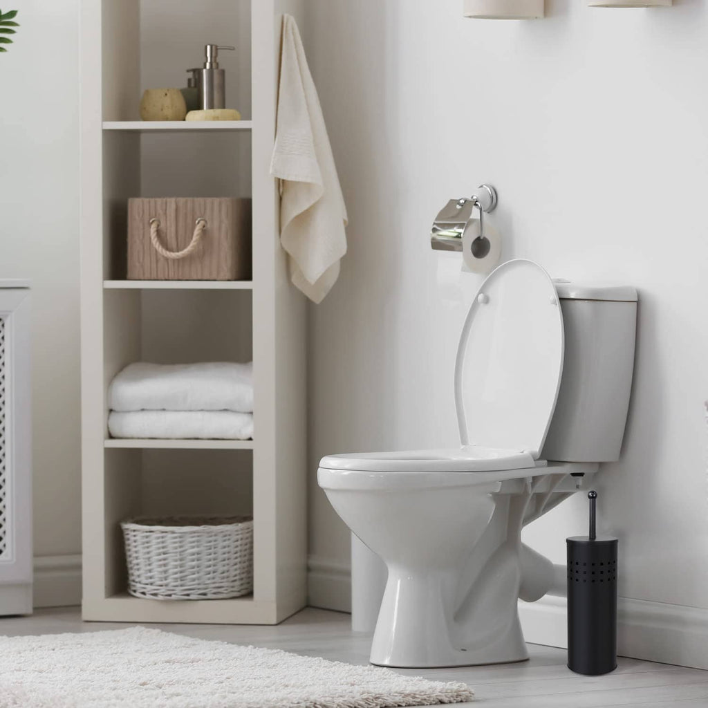 Black plunger with perforated holder standing next to a white toilet