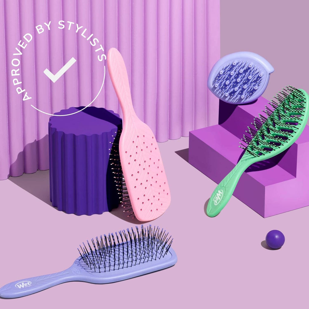 Pale pink curl detangler hair brush with pin bristles and ergonomic handle