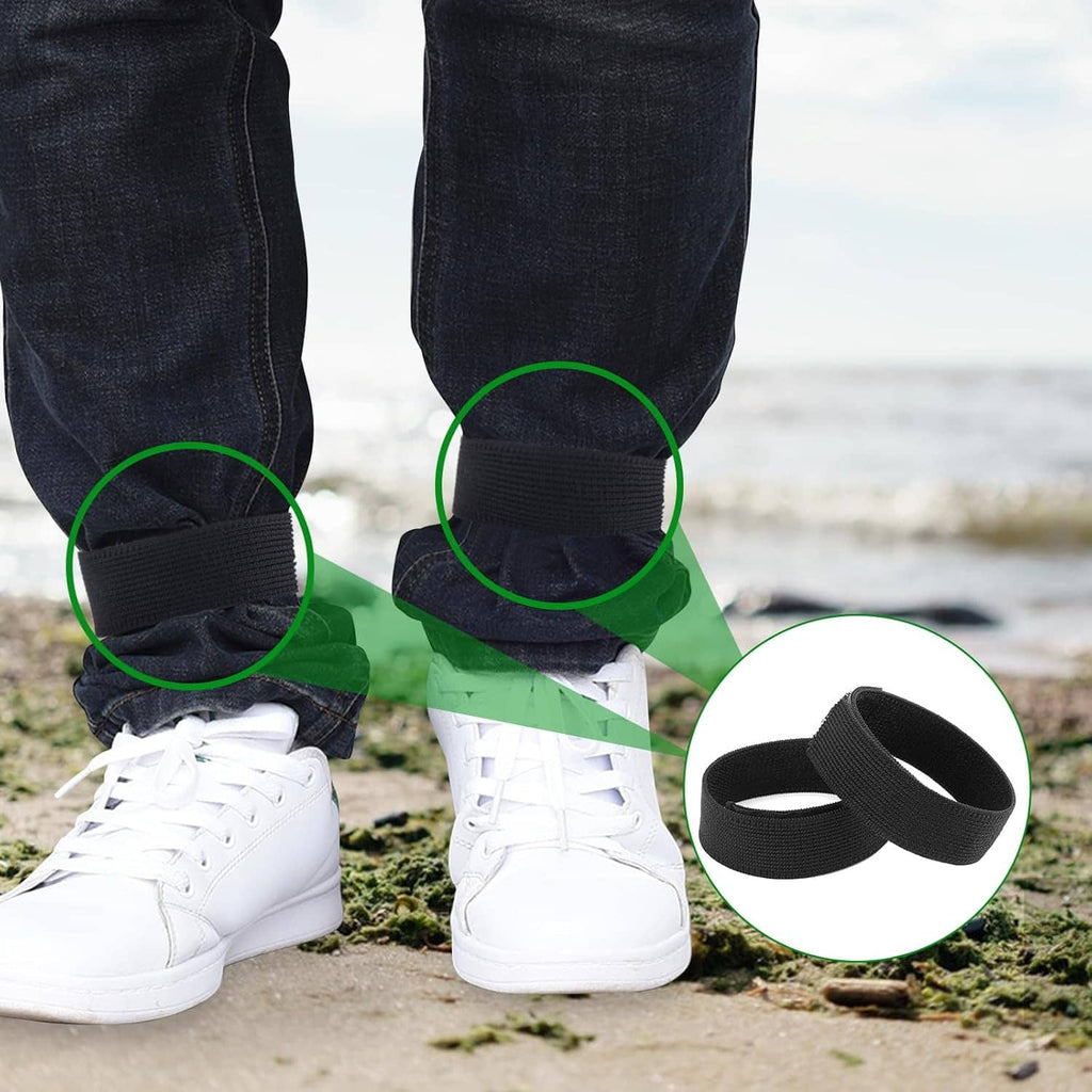 Black ankle boot blousing straps shown on pant cuffs with white sneakers