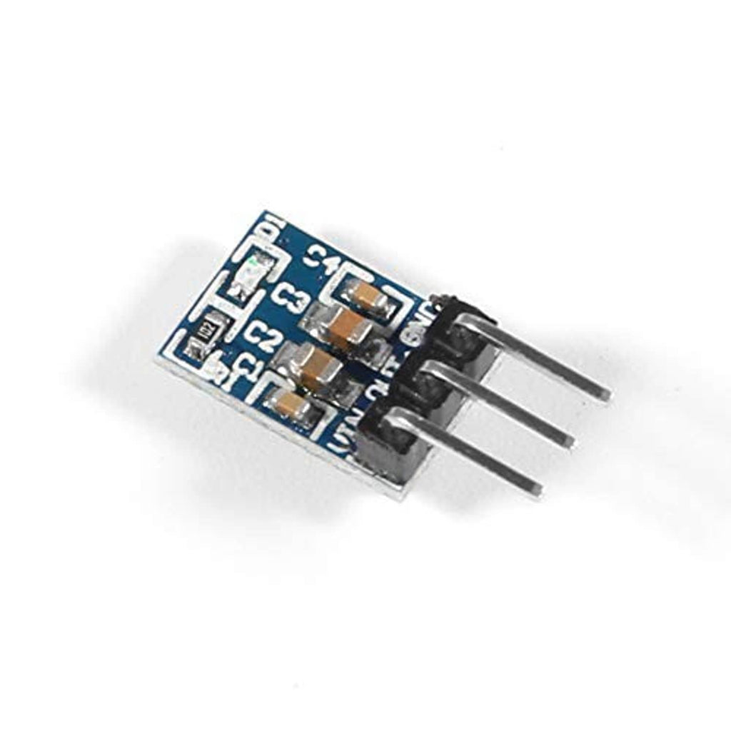 3.3V buck converter module with three pins and blue circuit board
