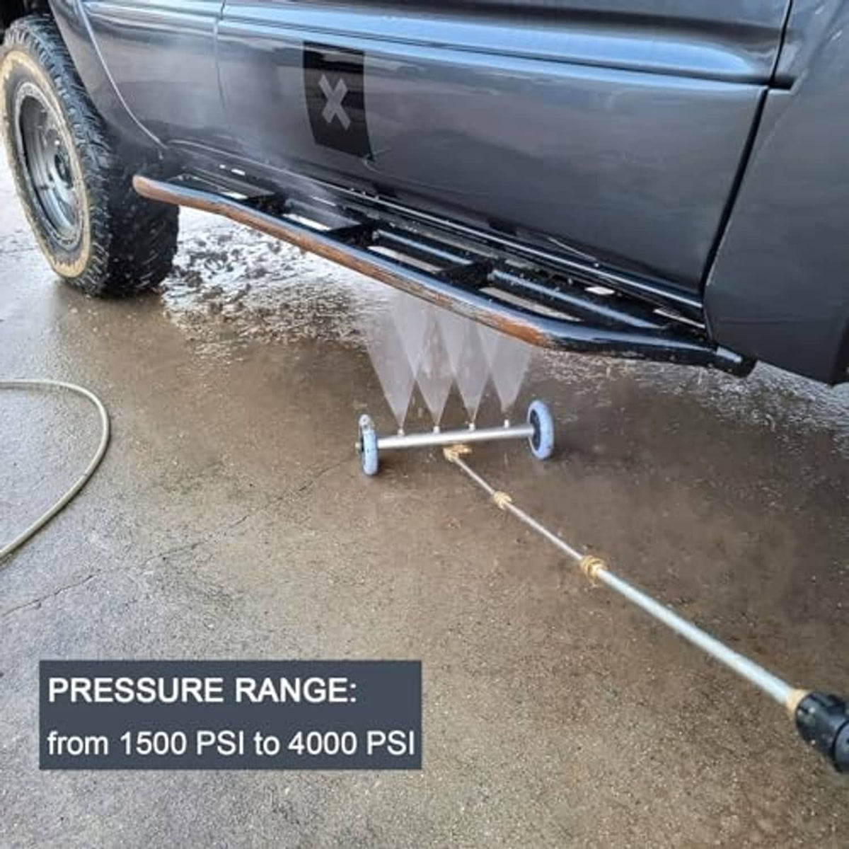 Undercarriage pressure washer water broom spraying from brass nozzle with blue wheels
