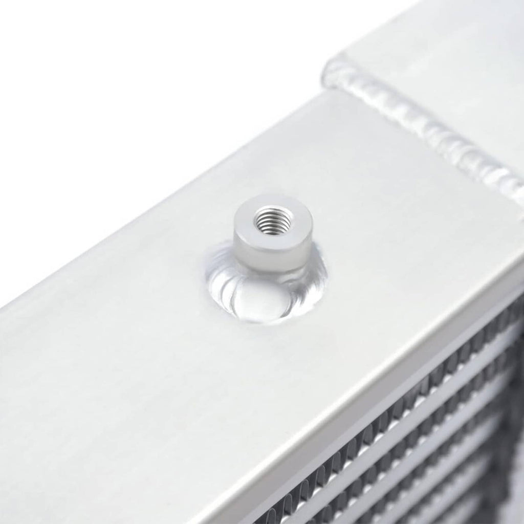 Aluminum intercooler end plate with threaded mounting bung on top surface