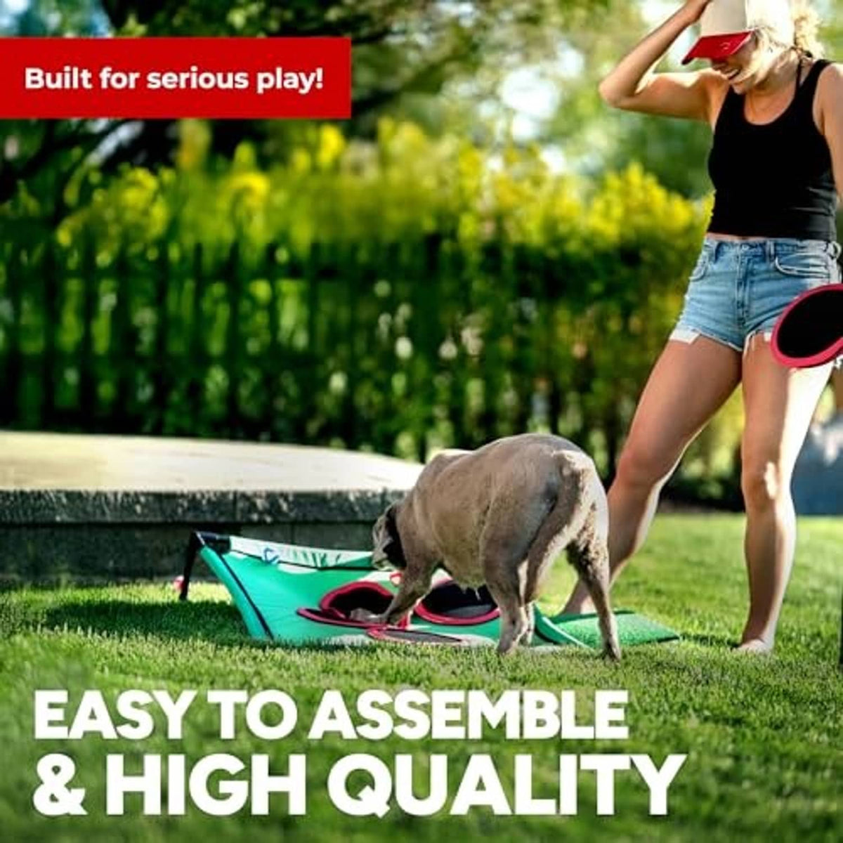 Green outdoor golf pong board with red ring targets on grass for easy play