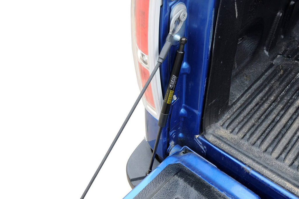 Tailgate assist strut and rod on open blue truck tailgate