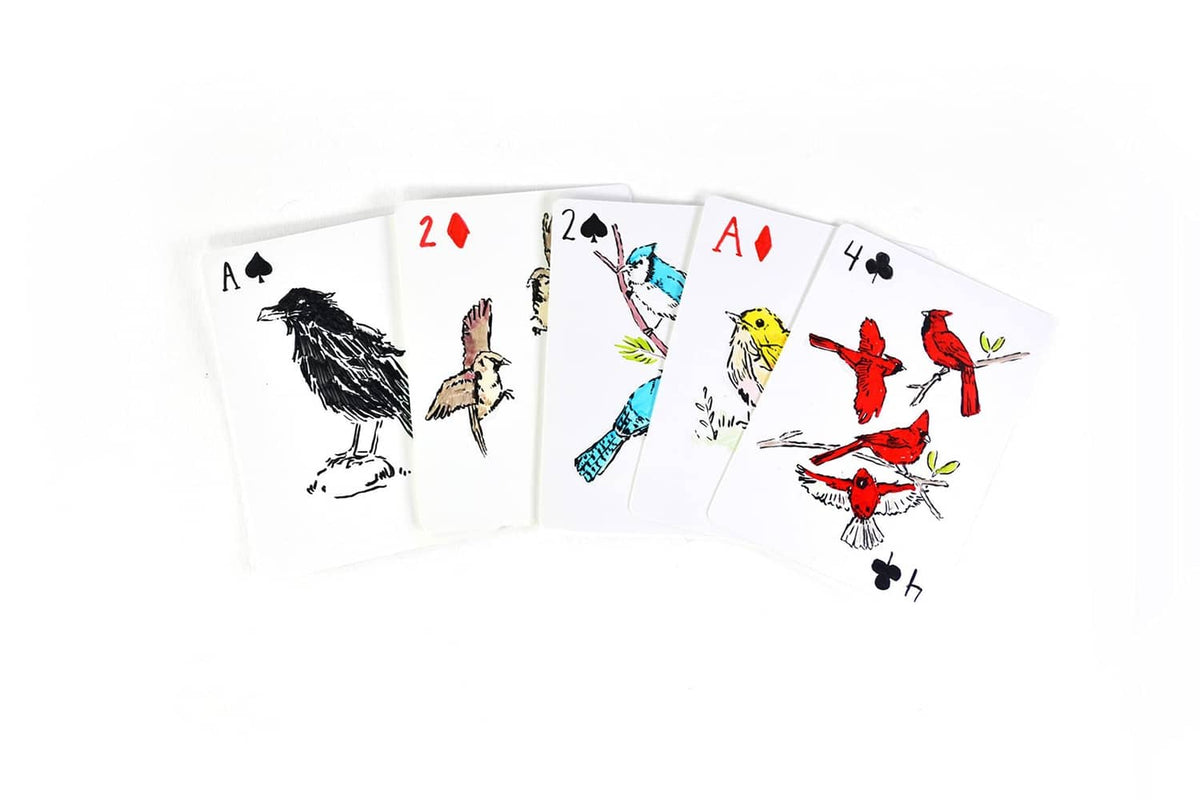 Fan of playing cards with colorful bird and cat illustrations on faces