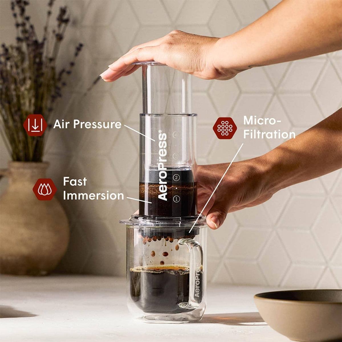 AeroPress filter disc fitted in brewing chamber during coffee making