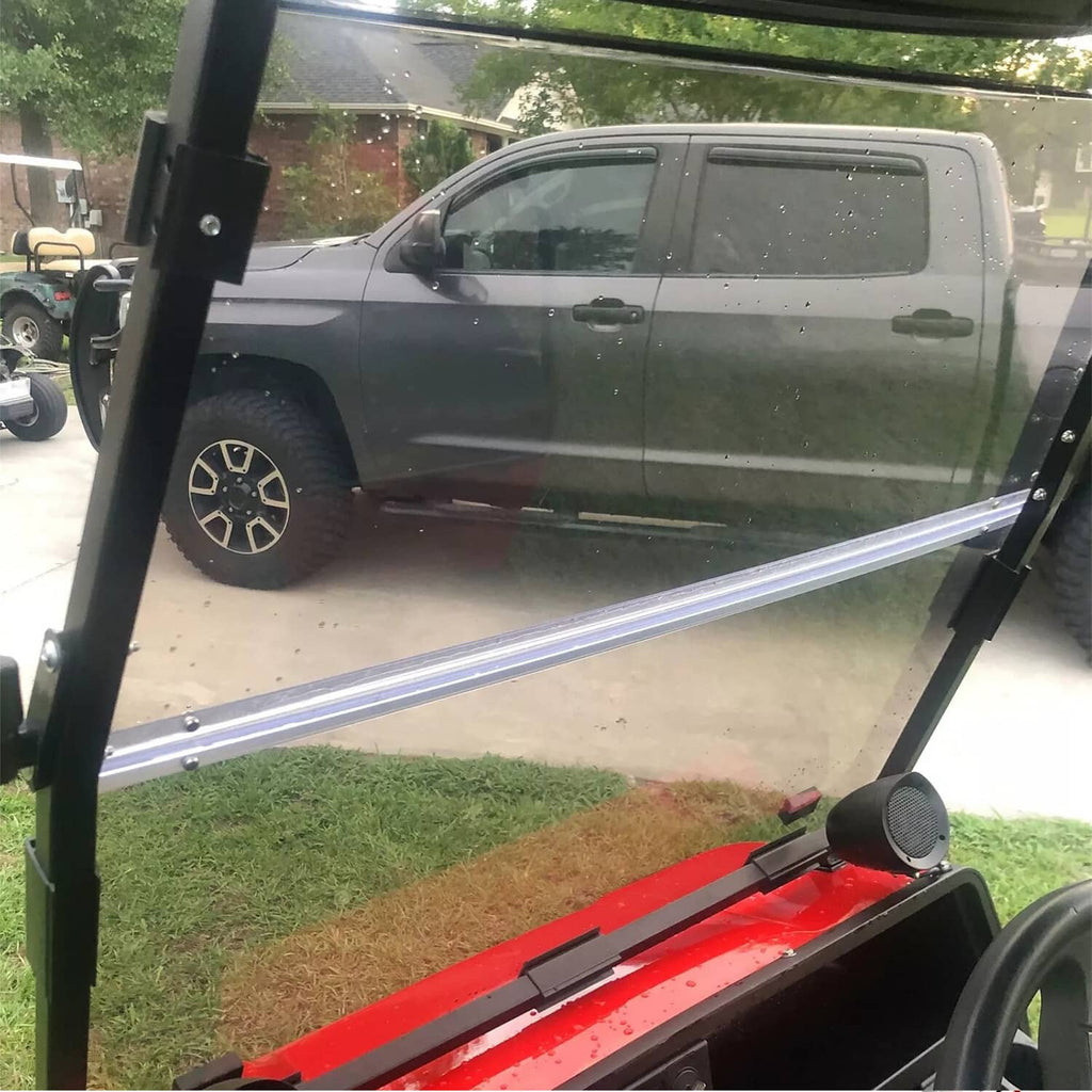 Tinted folding windshield installed on golf cart, translucent light smoke panel