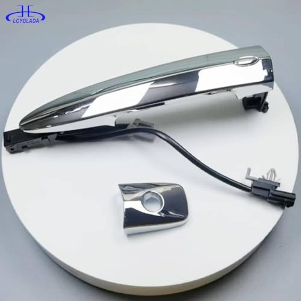 Chrome door handle with keyhole-less cap piece and attached black connector wires