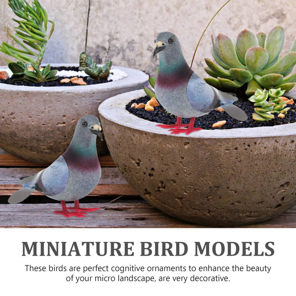 Two lifelike foam pigeons in gray, teal and maroon on garden planter