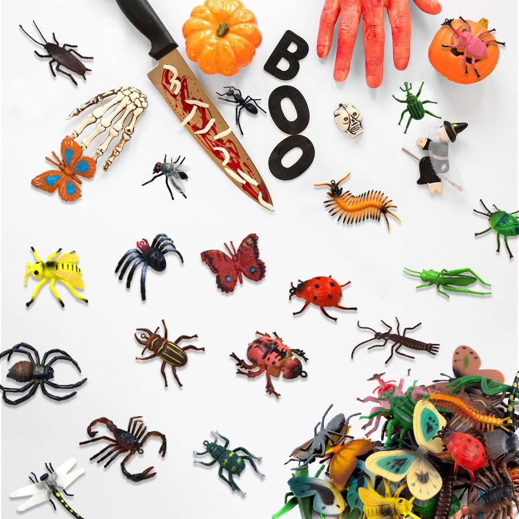 Assorted colorful plastic bug toy set, scattered insects and spiders
