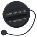 Black fuel tank filler cap with tether cord and click-close label, cap top view