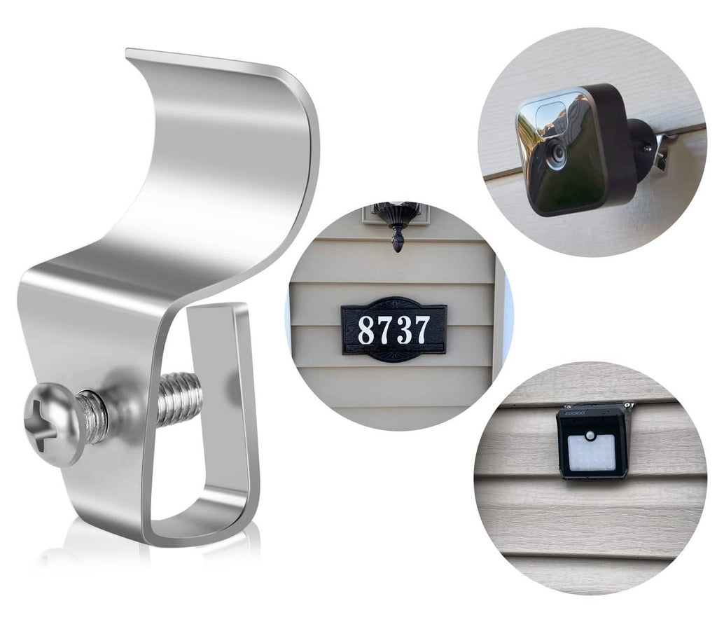 Silver no-hole siding camera mount clips with screw threads, shown with an installed camera
