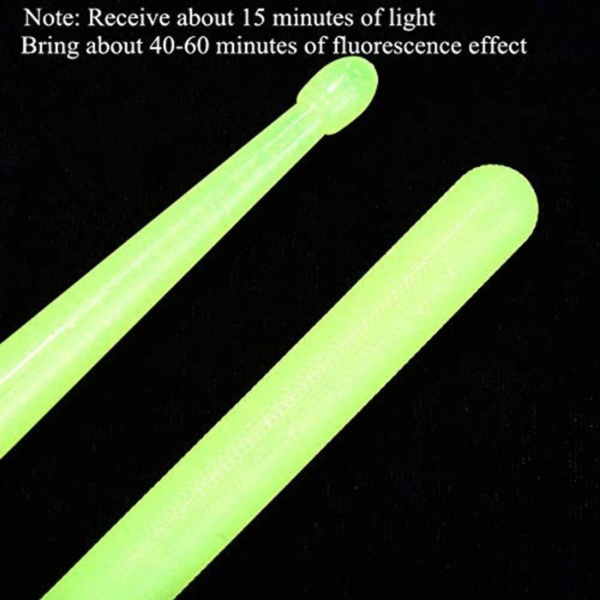 Neon green glow drum sticks close-up, smooth cylindrical body with rounded tips