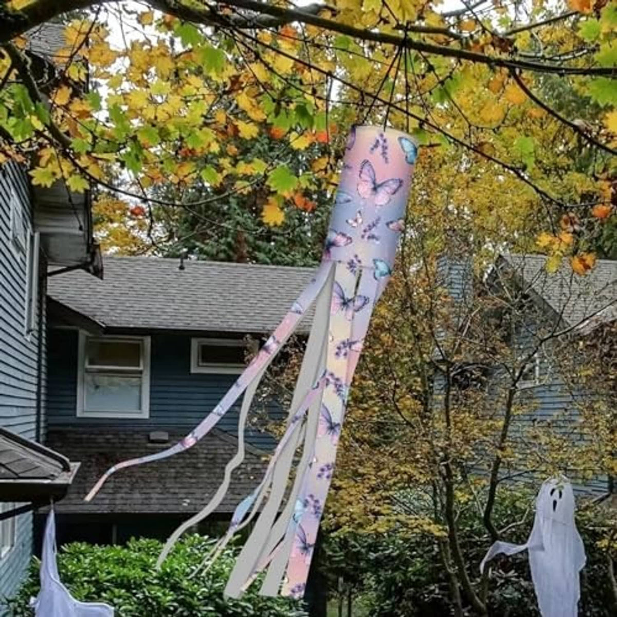 Butterfly print windsock flag outdoors with long flowing ribbon tails