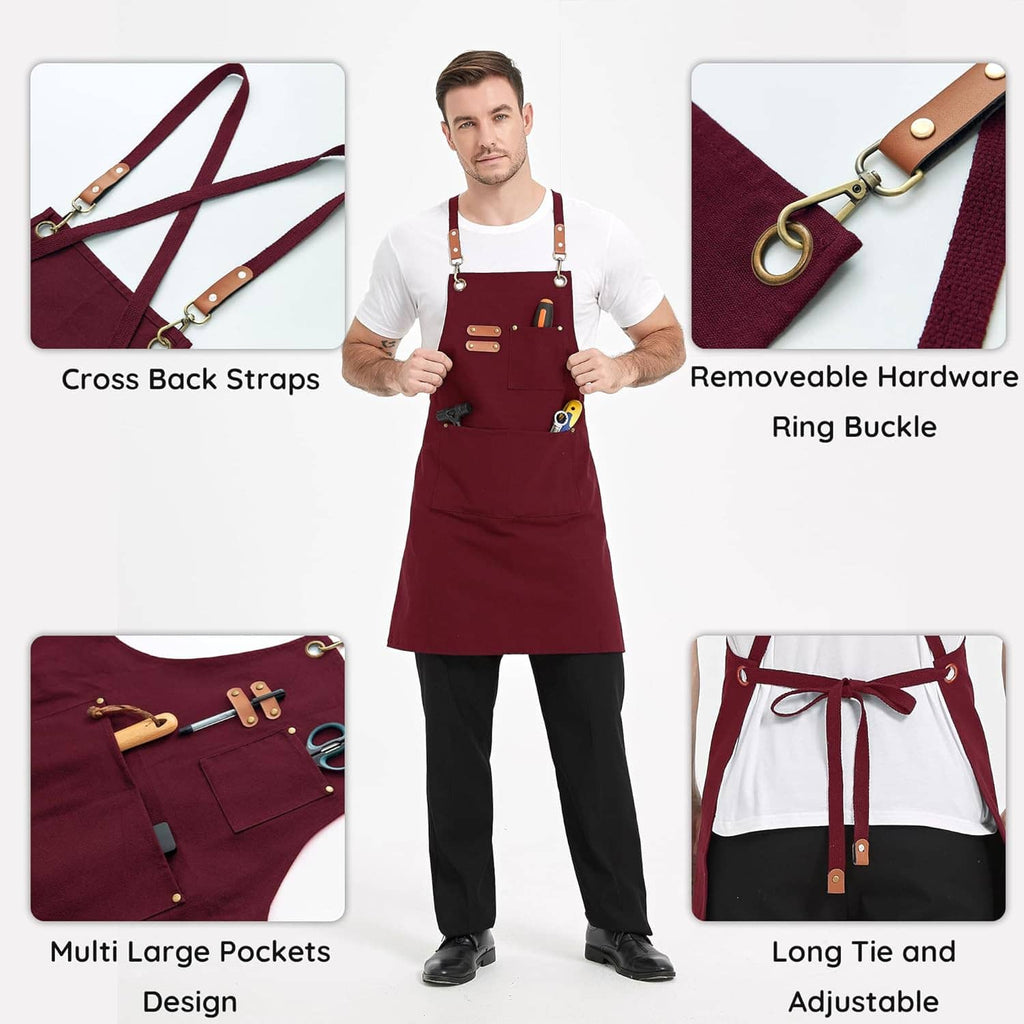 Burgundy canvas apron with cross-back straps, ring buckle hardware, and large front pockets