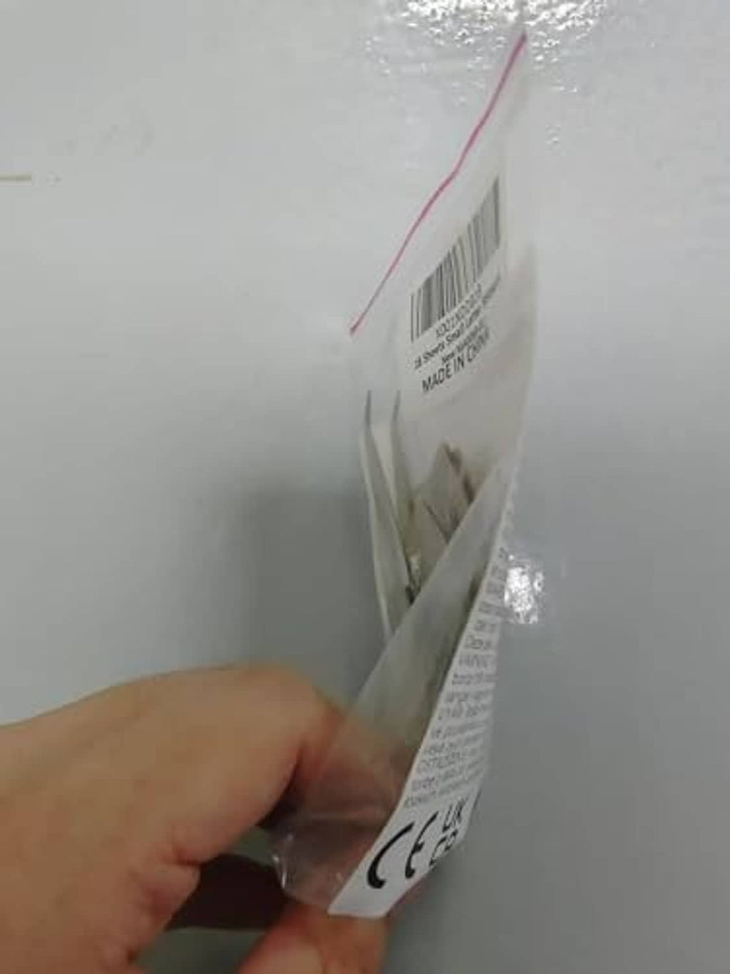 Sealed packaging of gold and silver letter and number sticker sheets with label
