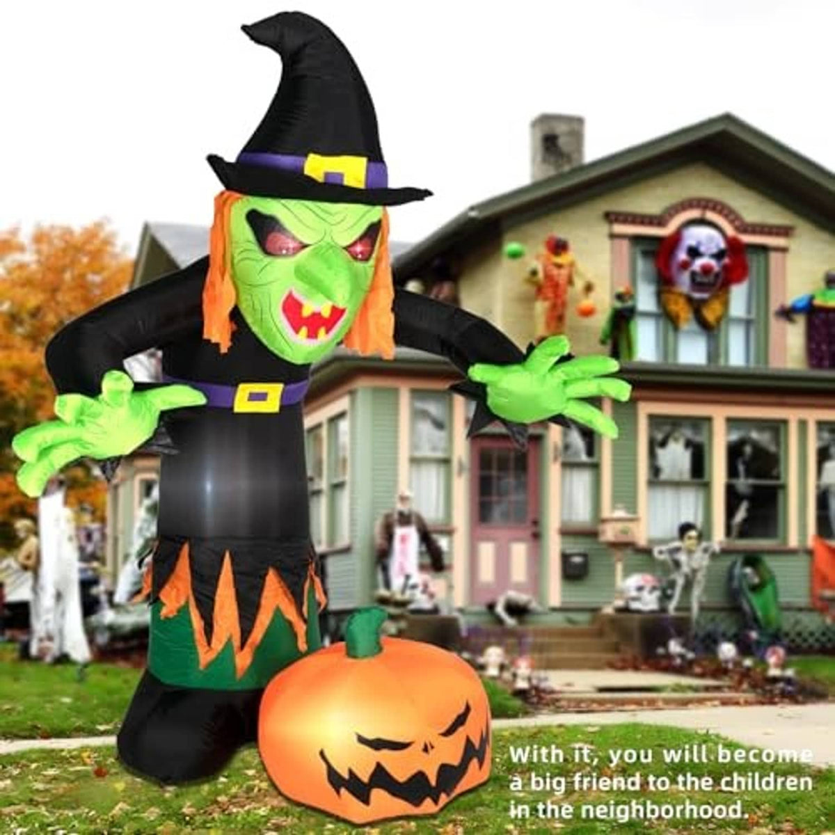 Inflatable Halloween witch with green face, black hat, and jack-o'-lantern belly