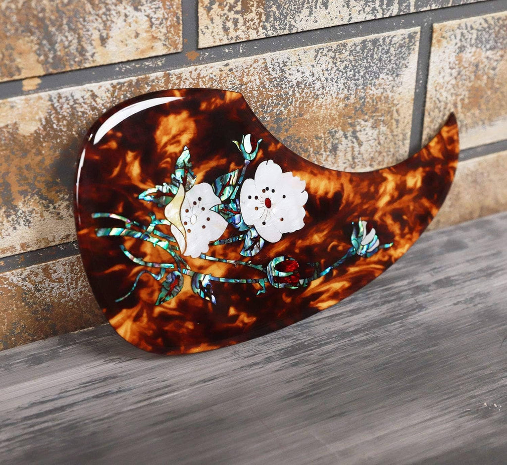 Curved acoustic guitar pick guard with tortoiseshell look and abalone white flower inlay