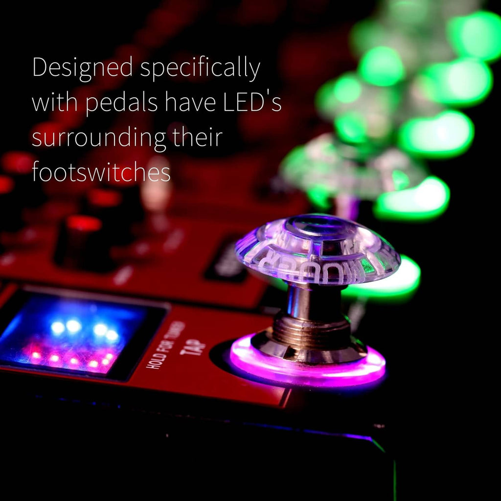 Clear mushroom-shaped footswitch topper on guitar pedal with glowing LED lights