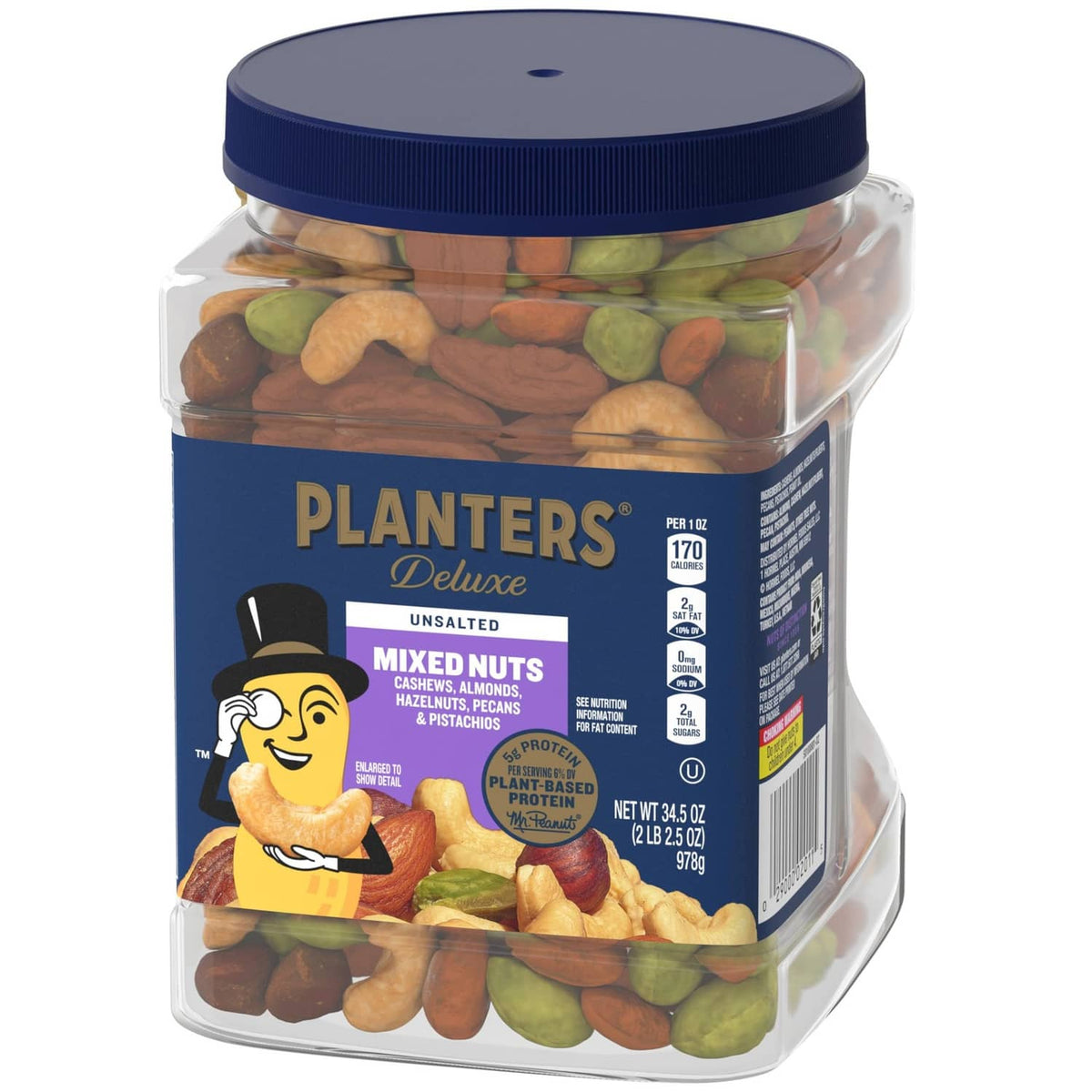 Clear mixed nuts jar with navy lid and front label showing cashews, almonds, pistachios