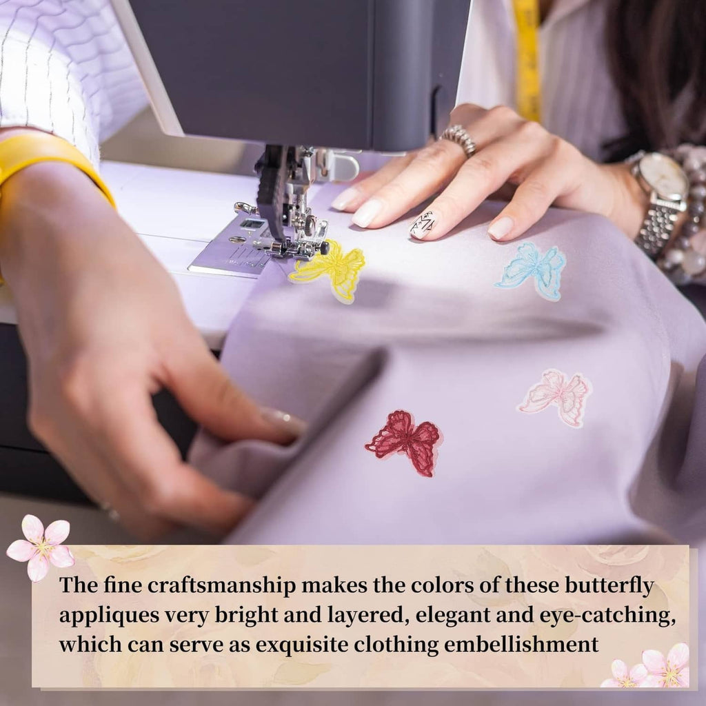 Butterfly appliques being sewn onto light fabric with visible stitched wing motifs