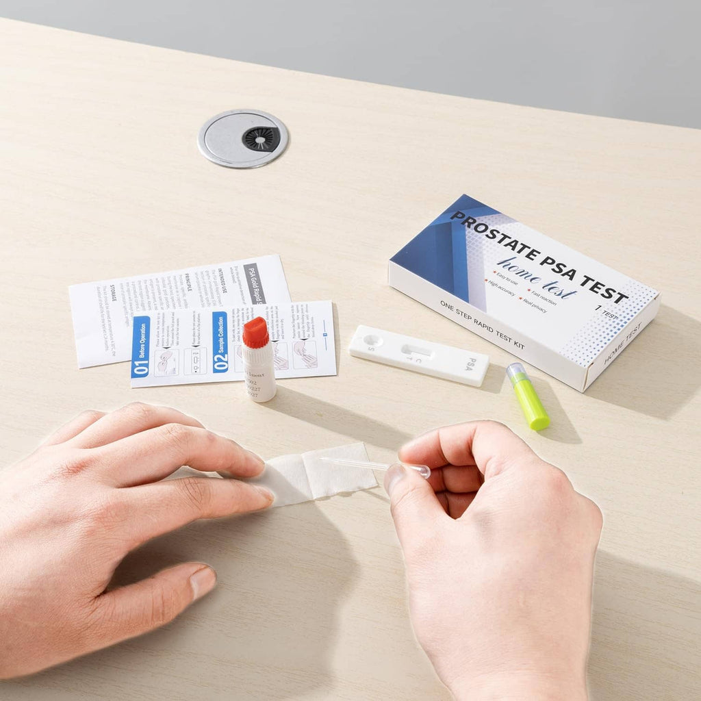 At-home prostate PSA test kit components, swabs, vial, and instructions on table