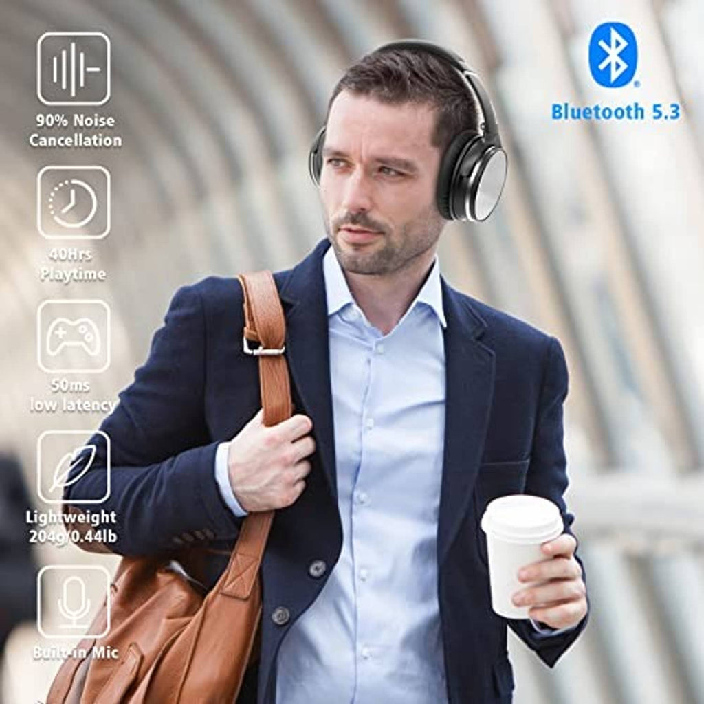 Black over-ear headphones worn by a man with padded headband and ear cups