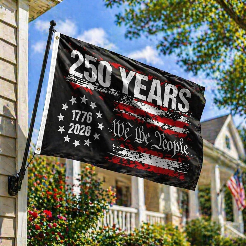 Black 250 years USA flag on a pole with star field, red stripe accents, and “We the People”