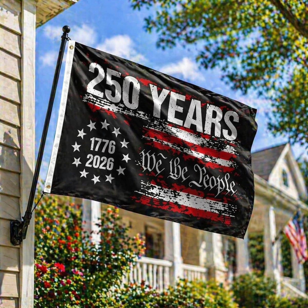 Black 250 years USA flag on a pole with star field, red stripe accents, and “We the People”