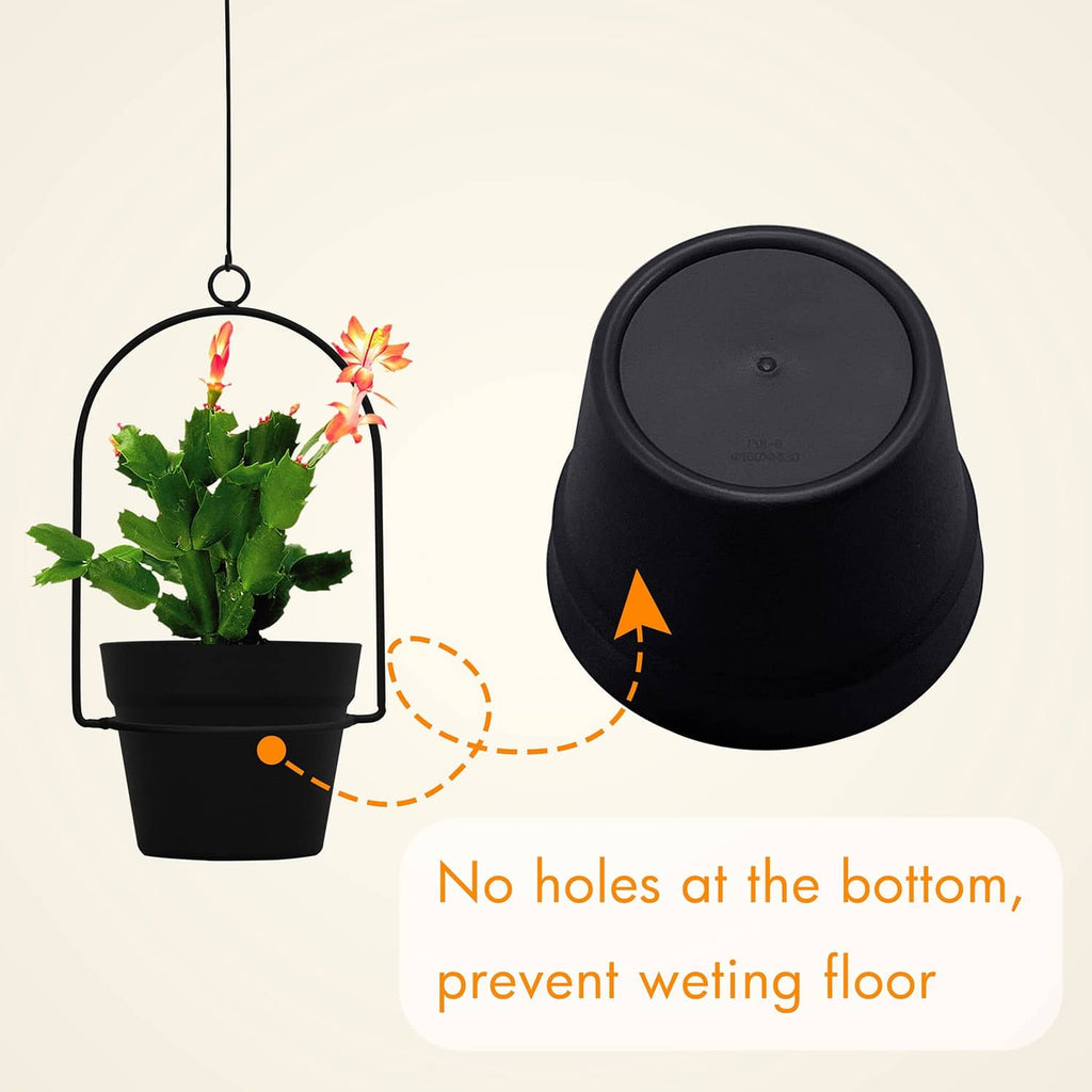 Black hanging plant pot with flowers and solid bottom designed to help prevent pooling