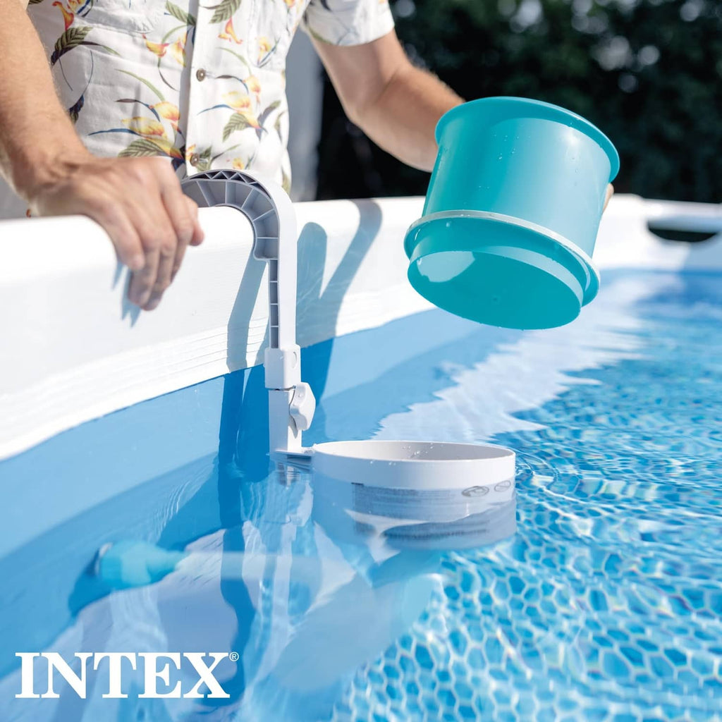 Pool surface skimmer being fitted to the pool wall with blue collection basket