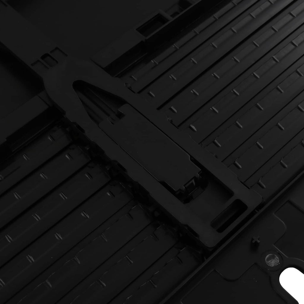 Close-up of black grille air shutter plastic channels with mounting tabs