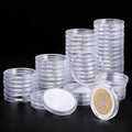 Clear plastic coin capsules set with stacked holders and one open round capsule