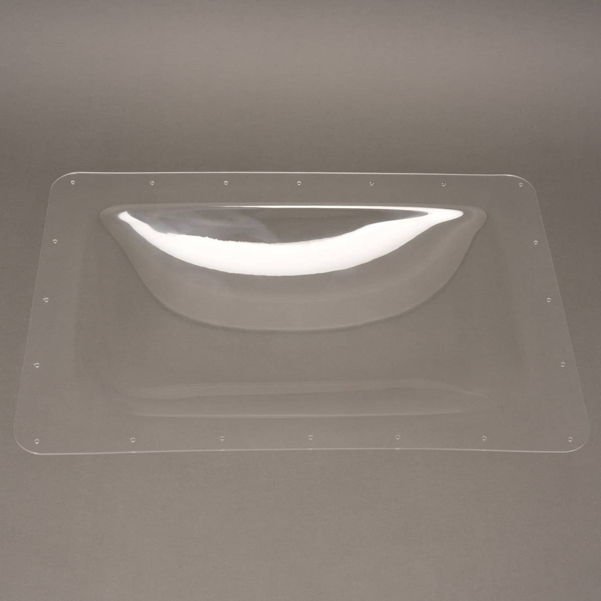 Clear plastic RV skylight cover on roof, rectangular panel with raised dome window