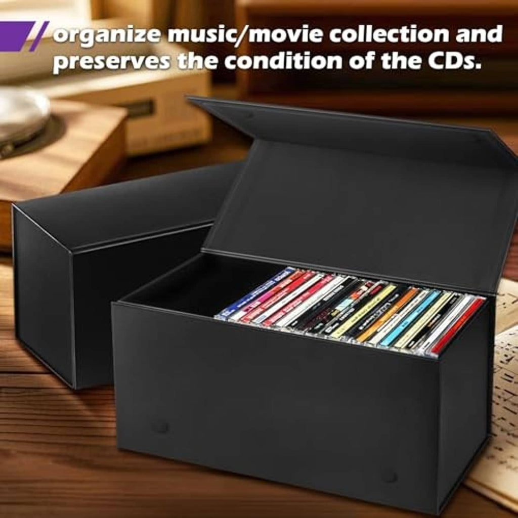 Two black CD storage boxes with lids open, jewel cases stored inside