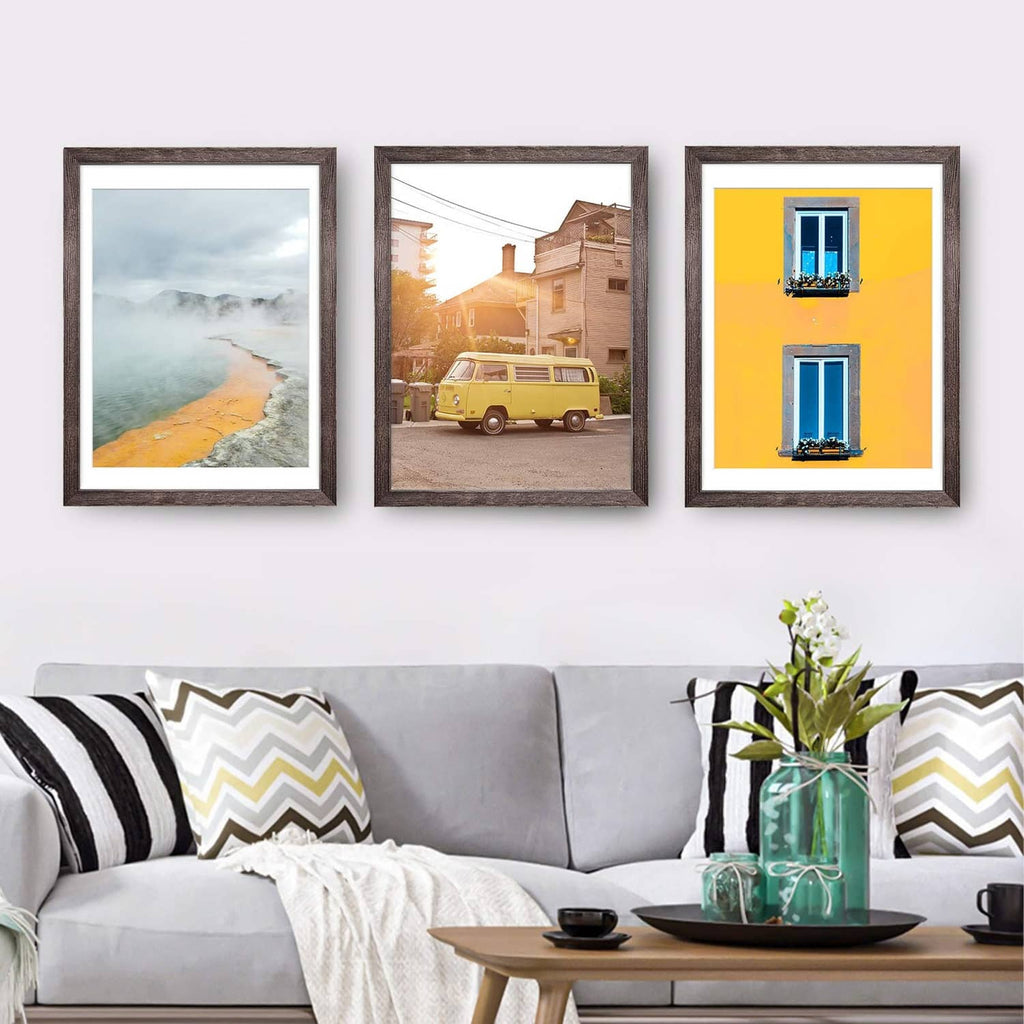 Set of three rustic brown picture frames with white mat borders