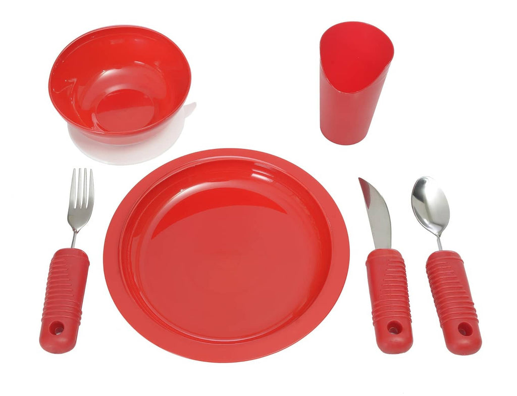 Red adaptive dinnerware set with scoop bowl, plate, fork, spoon, and handled cup
