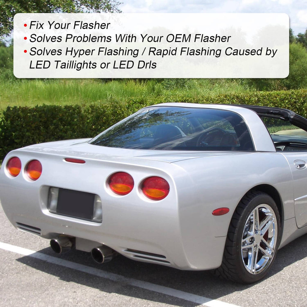 White C5 Corvette rear view with dual round tail lights and chrome wheels