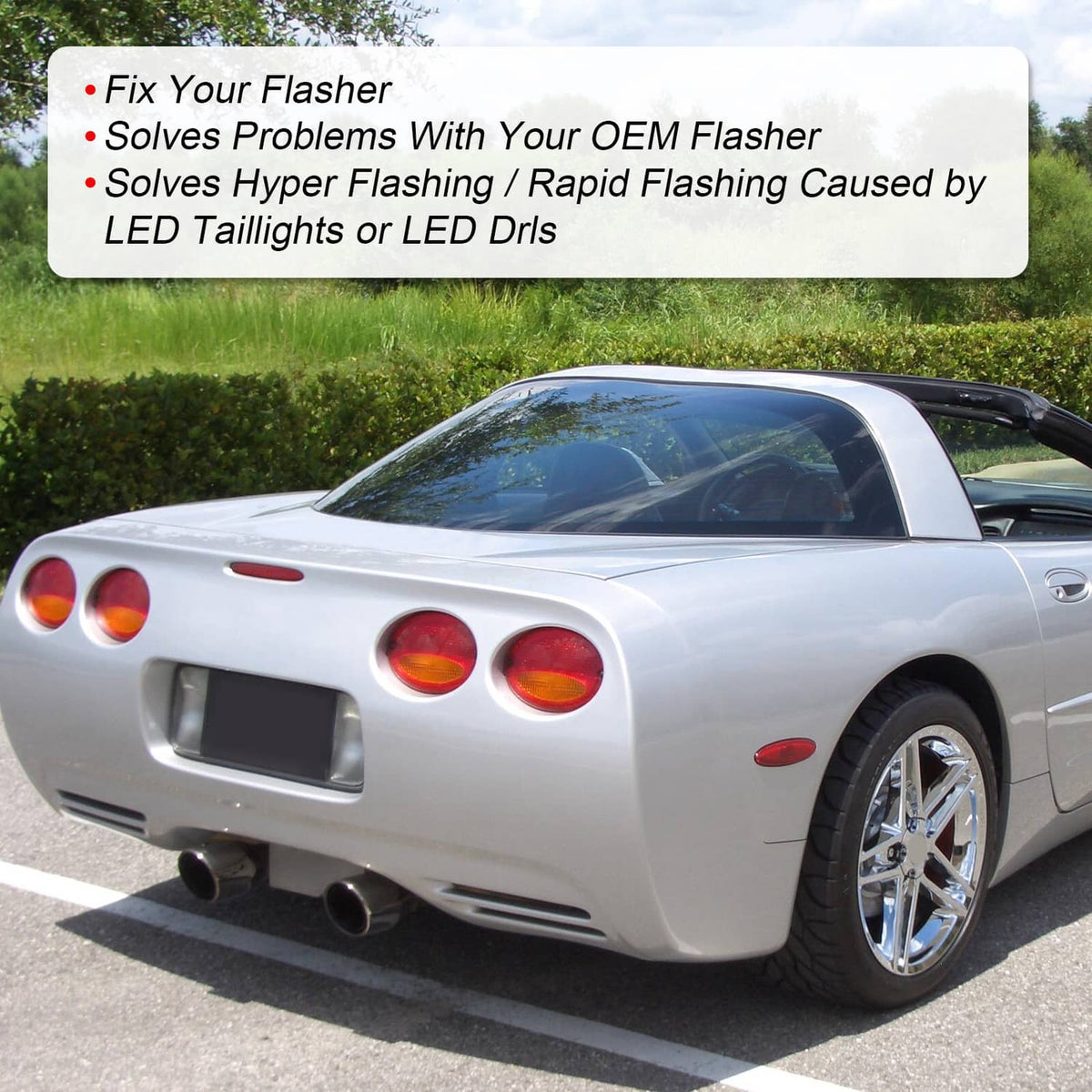 White C5 Corvette rear view with dual round tail lights and chrome wheels