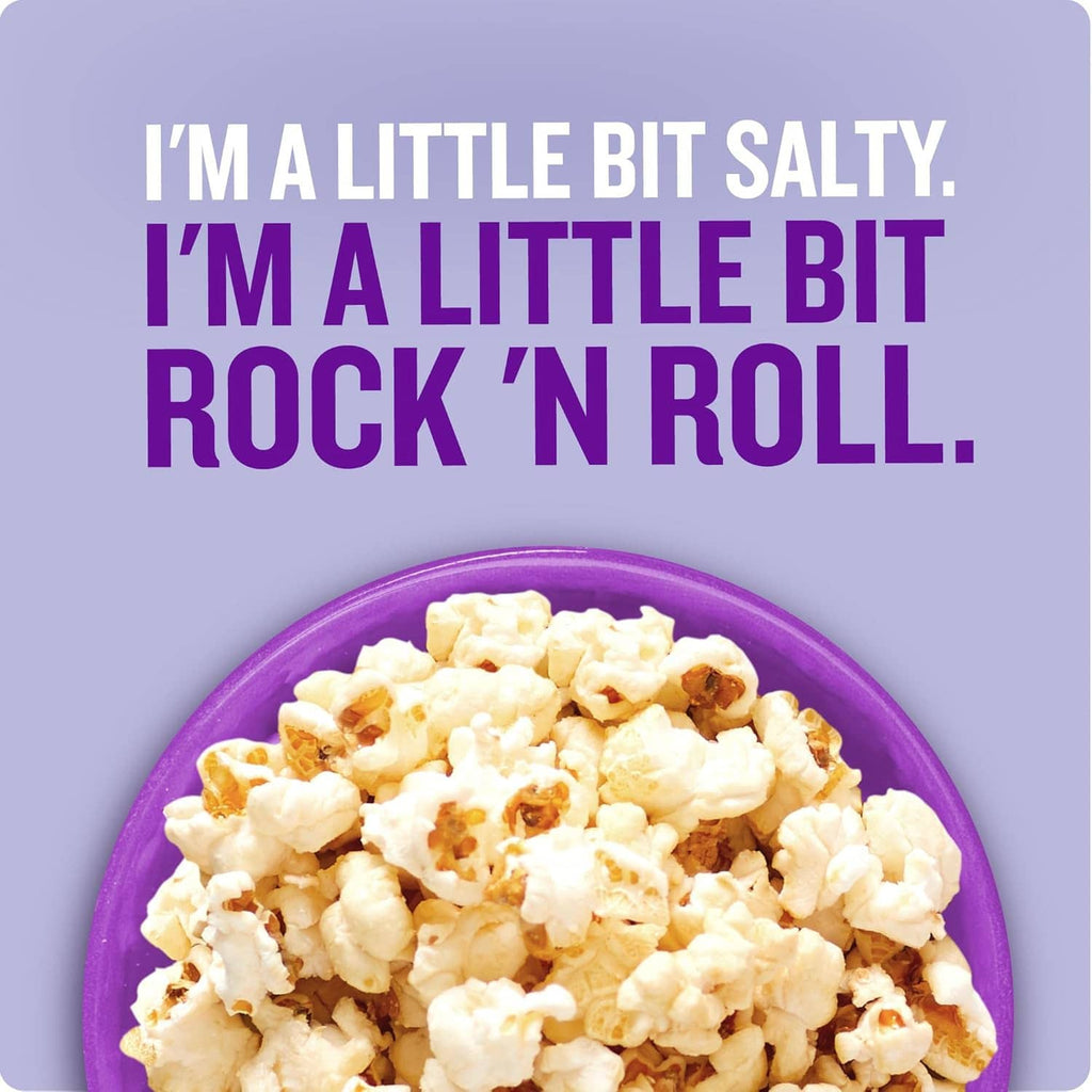 Bowl of kettle corn pieces in a purple dish, salted crunchy snack