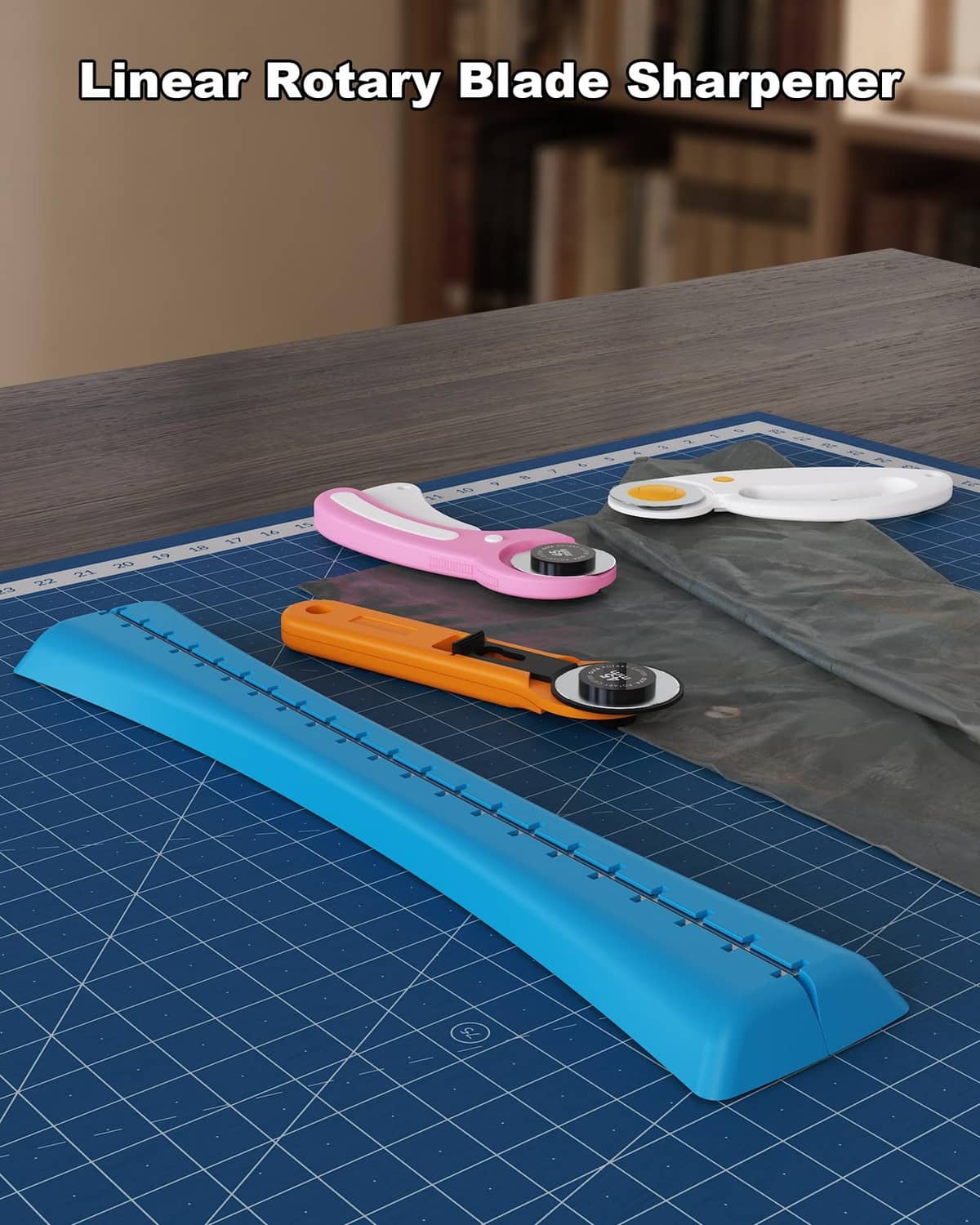 Blue linear blade sharpener guide with orange rotary cutter, shown on a cutting mat.