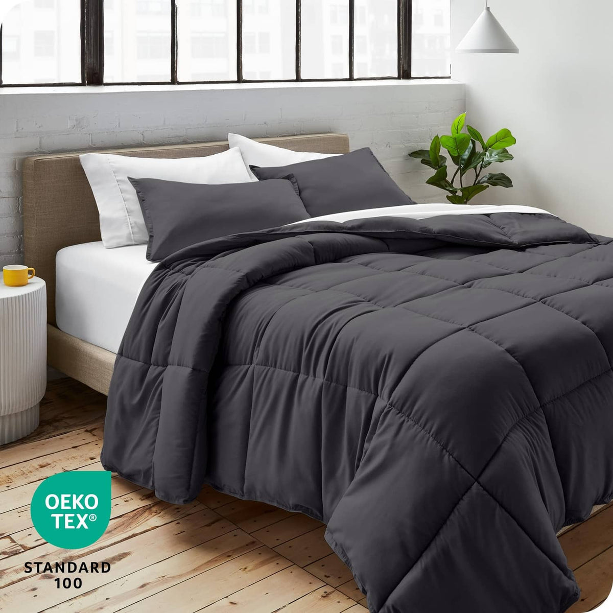 Grey full comforter set with two pillow shams on a bed