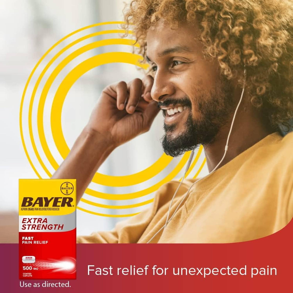 Bayer Extra Strength Aspirin box with 500 mg strength shown near a smiling man