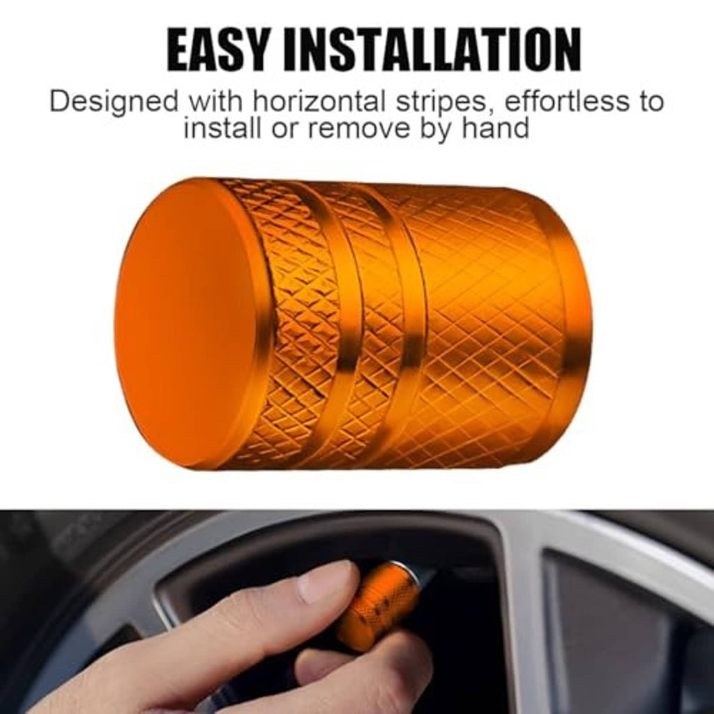 Orange metal tire valve stem cap with embossed grip, rounded end and liner