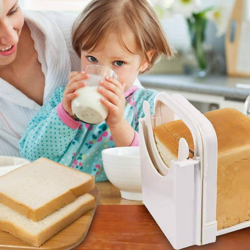 White bread slicer on a table with bread and a child holding a cup
