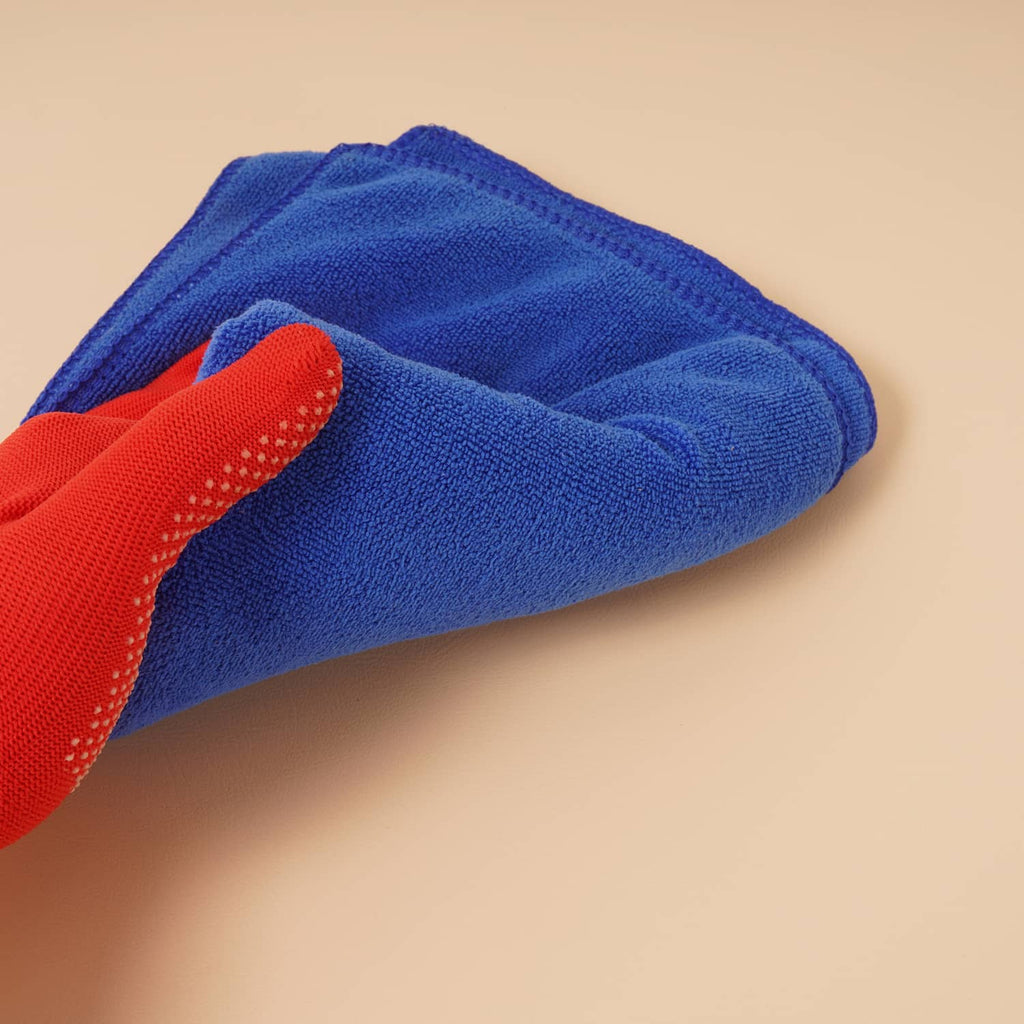 Tan seat cushion surface with blue and red cleaning cloth