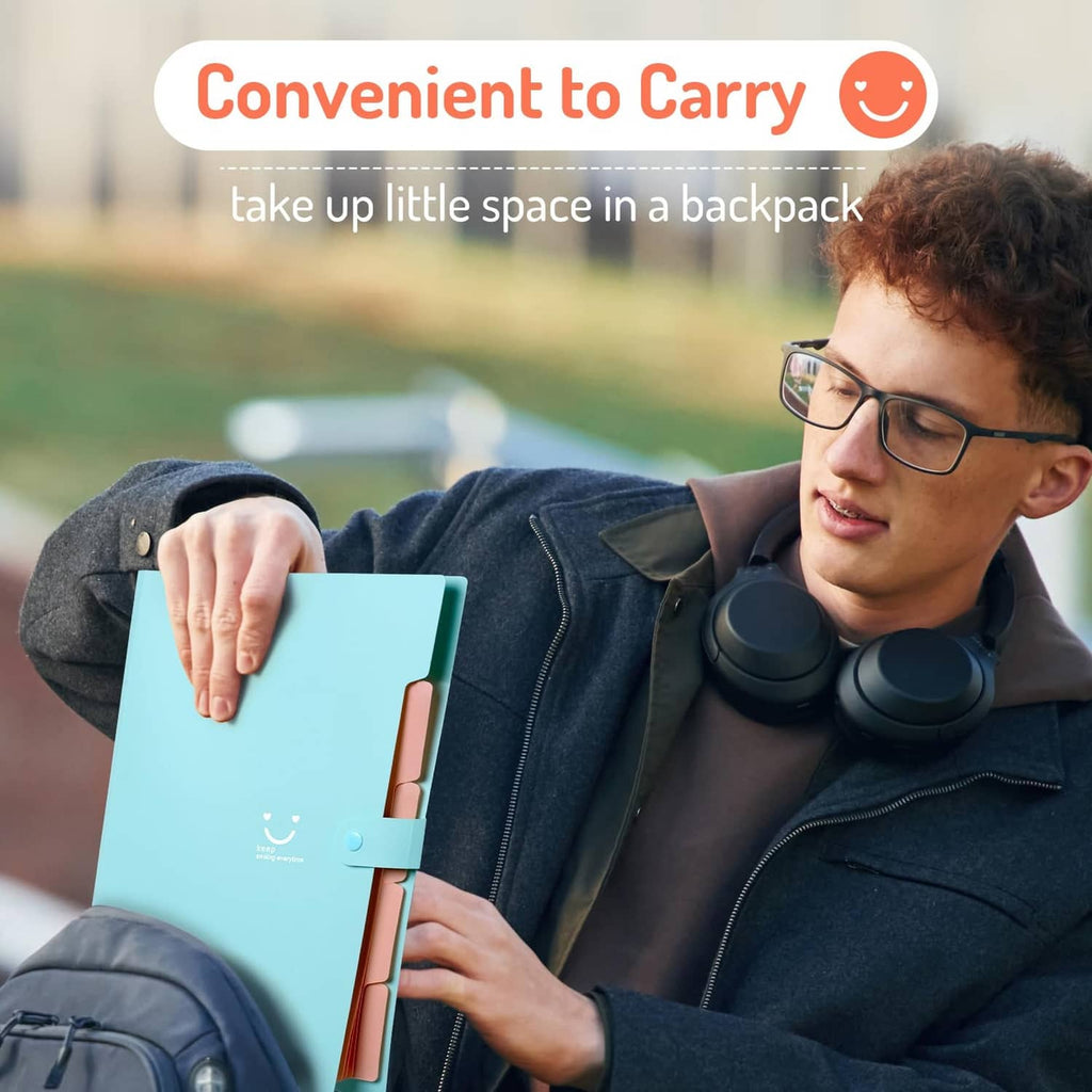 Light blue accordion file organizer held outdoors with snap closure strap